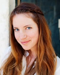 headshot of author with red hair