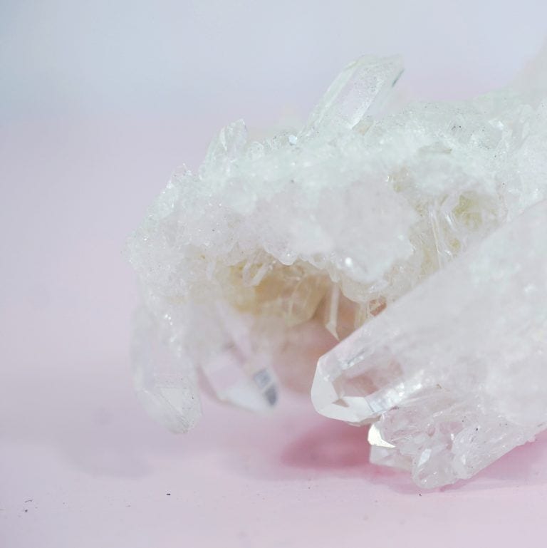 quartz crystal against pink background