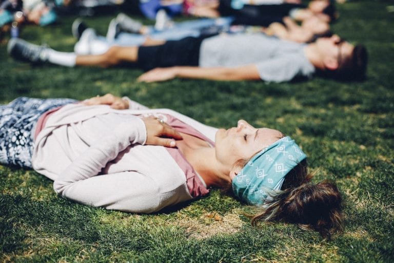 girl breathing on her back