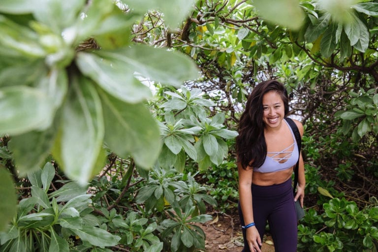 Girl wandering through the Hawaiian forest. 