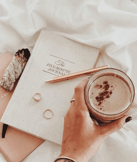 Five-minute journal with a cup of coffee. 