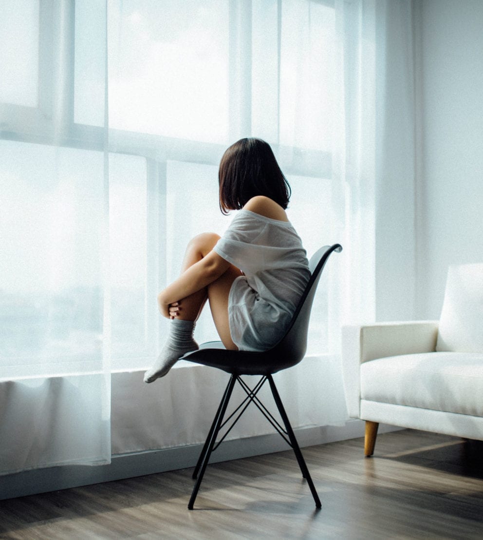 woman sitting by window