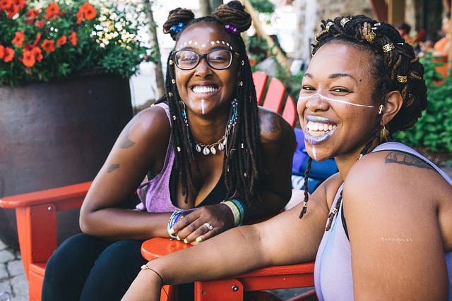 two girls with facepaint at festival