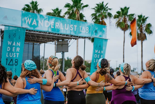 People holding each other's backs at wanderlust tampa 108