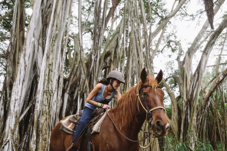 Woman petting her horse. 