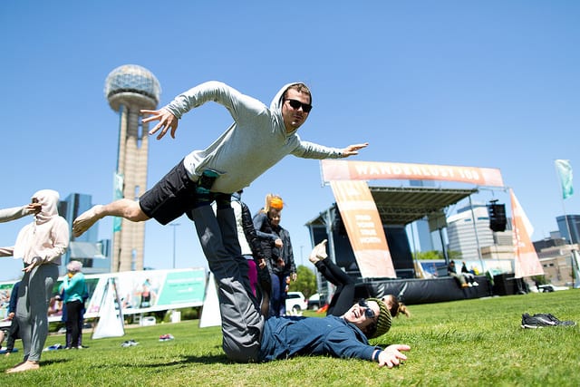 people doing acro in field 