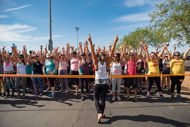 at start line for 5K run arms raised