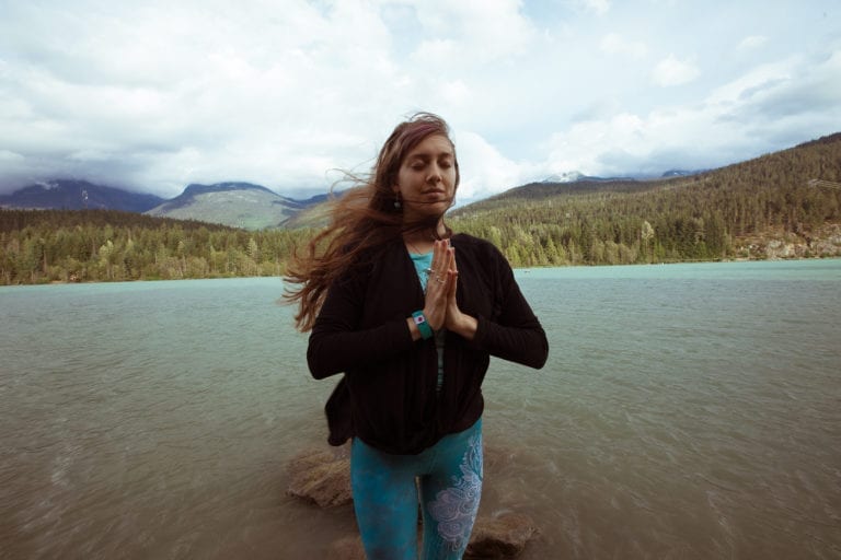 Woman standing in front of a lake in Whisler, Cananda