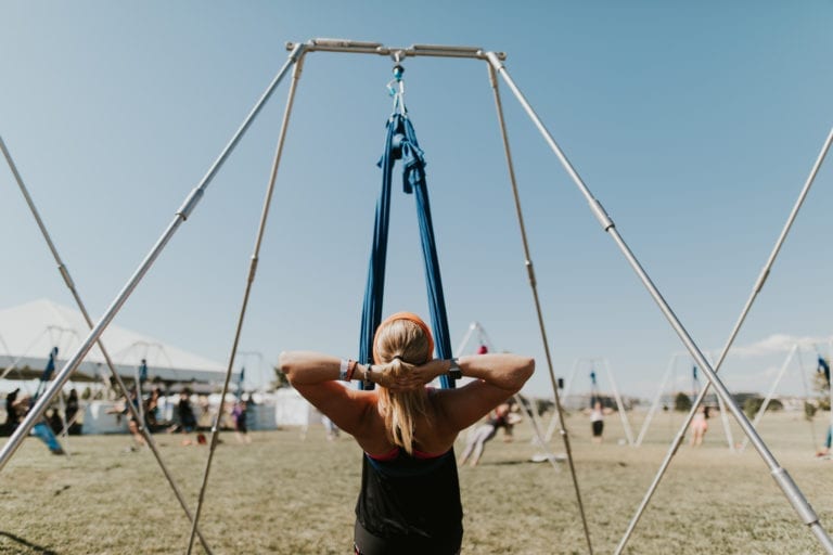 Woman in AirealYoga sling at Denver 108.