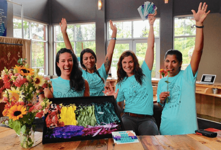 group of people in blue tshirts volunteering