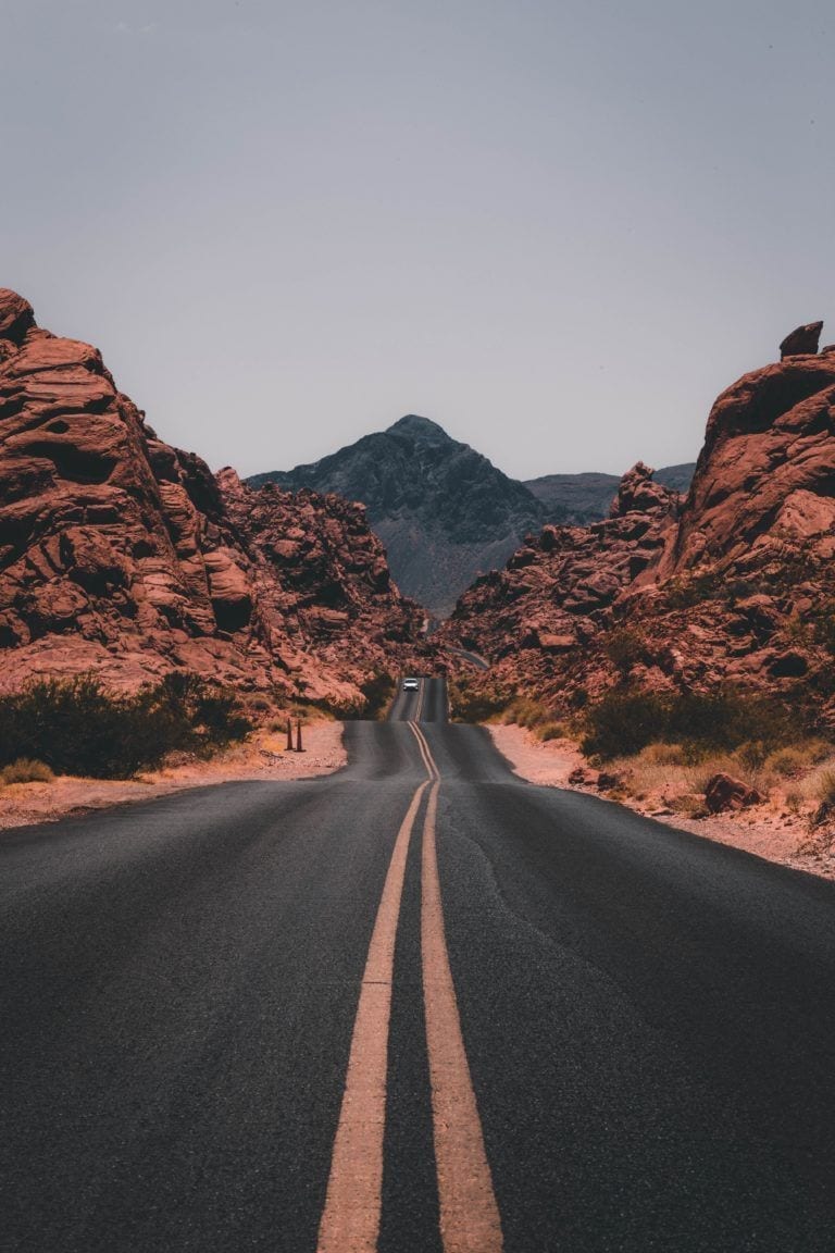 road with mountains on either side