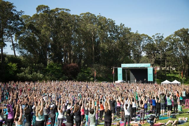 large scale outdoor yoga class wanderlust festival