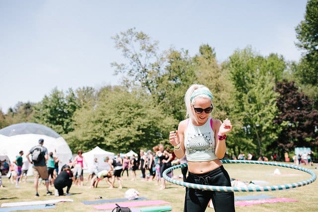 girl hula hooping at festival