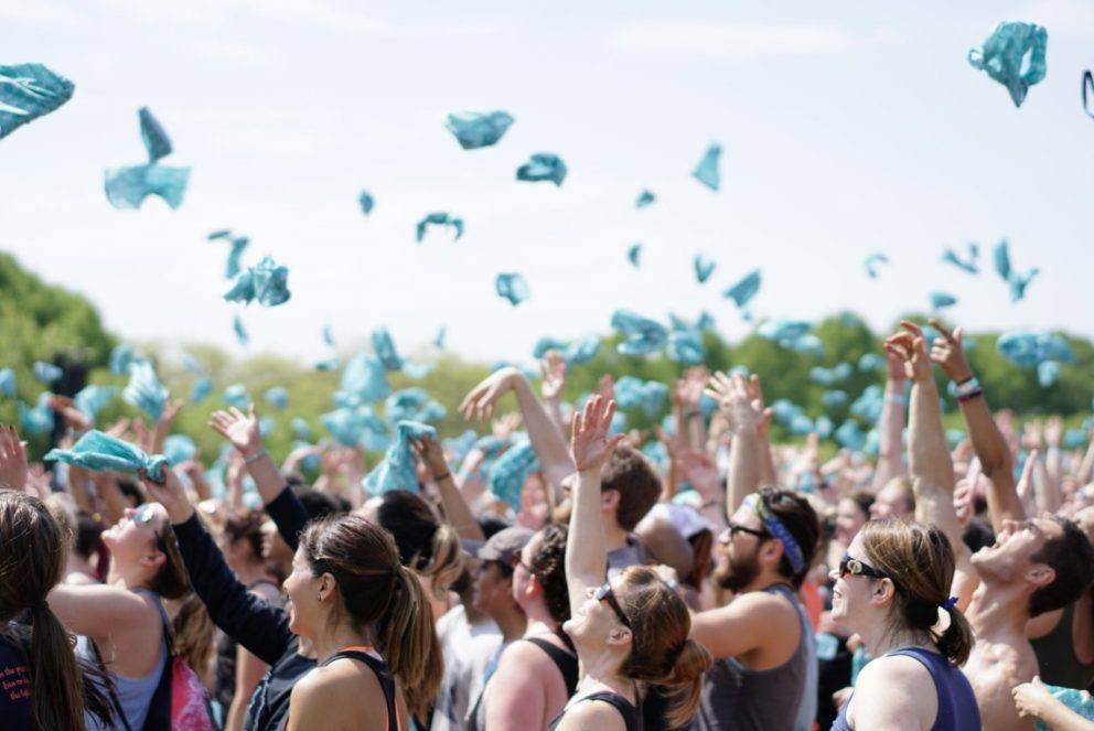 throwing bandanas up in crowd blue sky