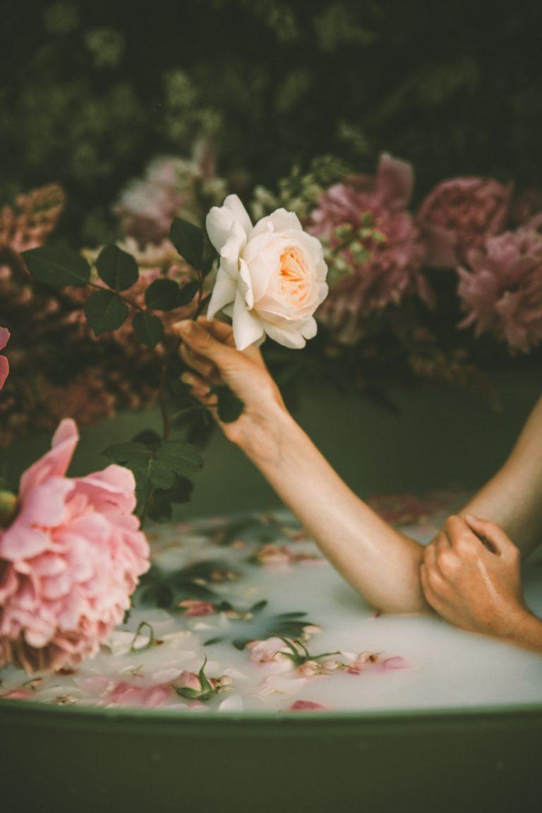 woman in bath with rose