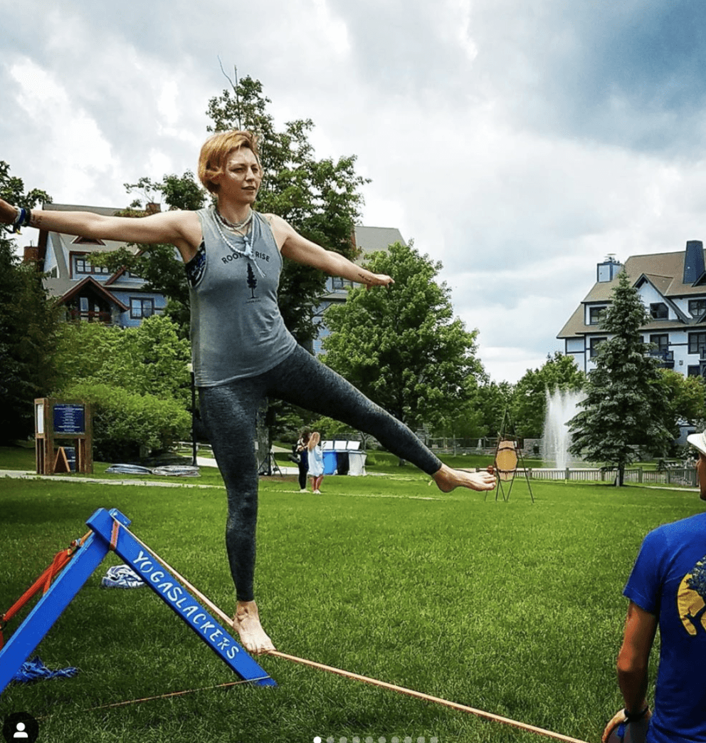 woman doing slacklining at festival